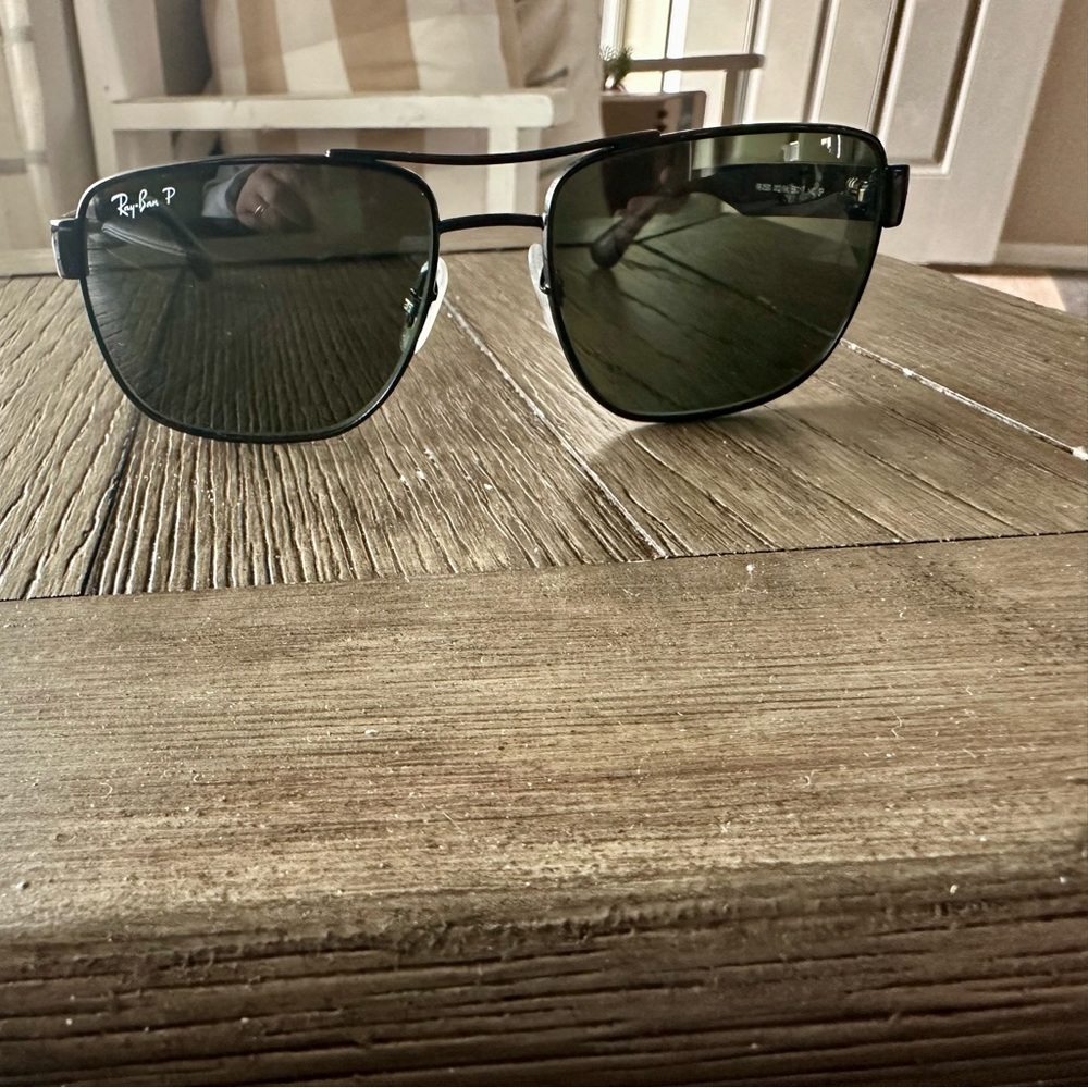 Black Rayban sunglasses.